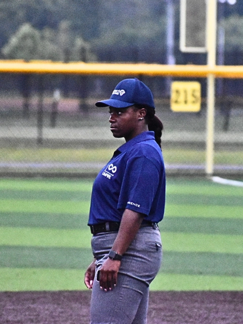 Umpire making a call behind home plate