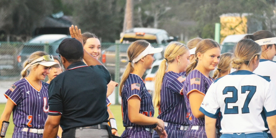 Umpires and athletes together after tournament play