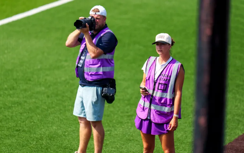 Connect Sports content team covering a softball event